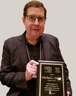 Mike Ediger holding award