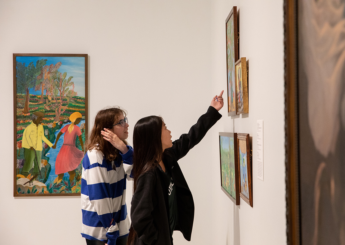 Two people looking at art at Spencer Art Museum